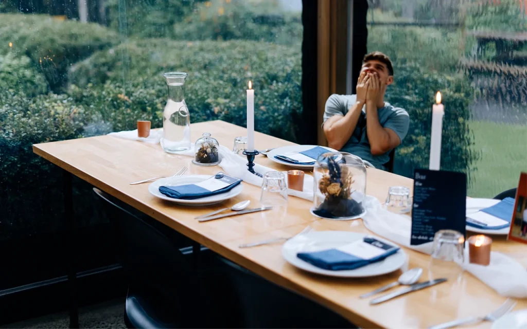 at the Solid Woods table laughing